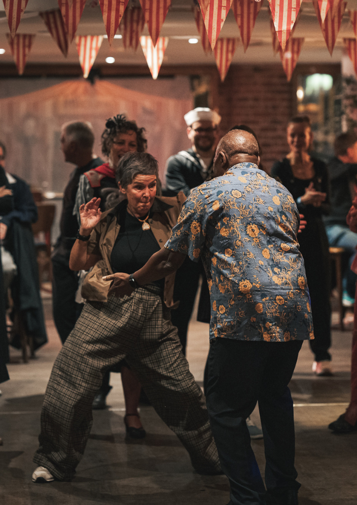 Two people dancing to Swing Music